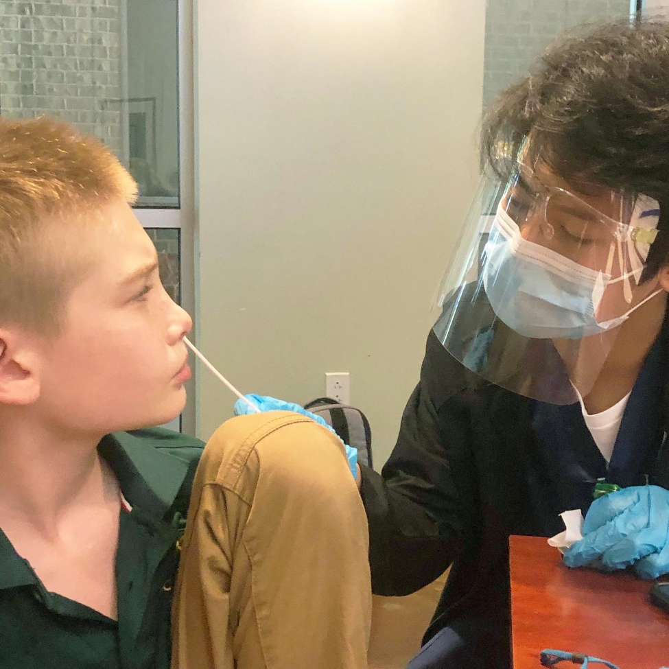 Pacesetter BSN student Tristan Yap administers a COVID-19 test to Monarch School student Sam Lenington. Pacesetter BSN student Tristan Yap administers a COVID-19 test to Monarch School student Sam Lenington.